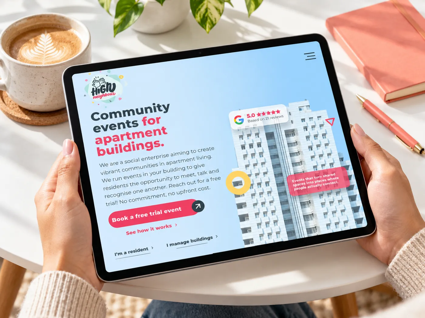 The High Neighbour website on a tablet at a communal table