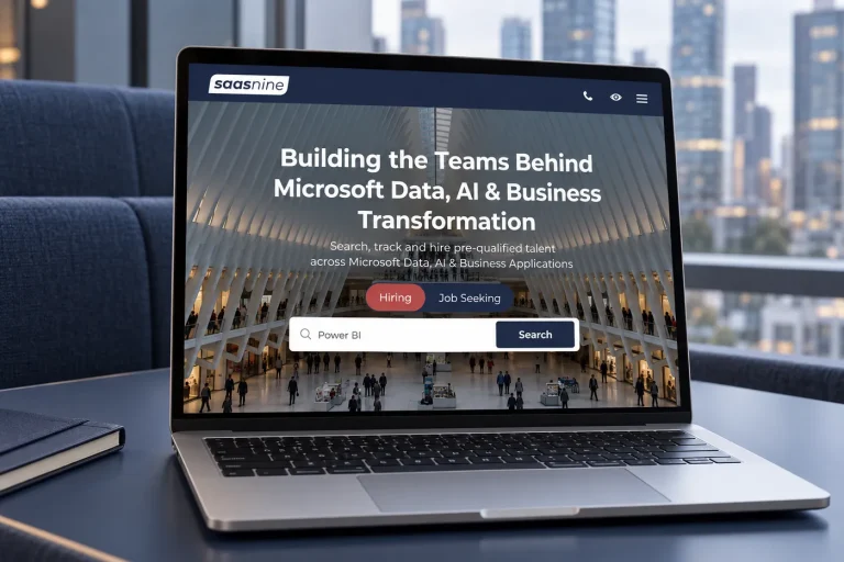 The SaaSnine website on a laptop in a work booth